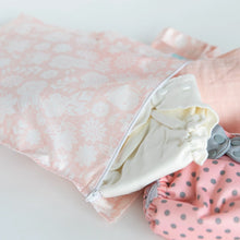 Load image into Gallery viewer, Close-up of Bumkins Wet Bag: Lace holding cloth diapers on a white background.
