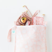 Load image into Gallery viewer, Bumkins Wet Bag: Lace lays on a white background with a swimsuit, sunglasses & tumbler peeking out.