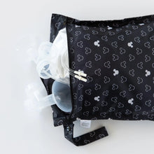 Load image into Gallery viewer, Bumkins Wet Bag: Mickey Mouse Icon Black + White holds breast pump parts on a white background.