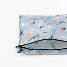 Load image into Gallery viewer, Bumkins Wet Bag: No Tricks, Just Treats lays unzipped on a white background, revealing its interior.