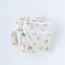 Load image into Gallery viewer, Bumkins Wet/Dry Bag: Palm Daze is folded on a white background.