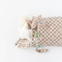 Load image into Gallery viewer, Bumkins Wet/Dry Bag: Sand Check holds a plush rabbit toy, star pillow, clothes, and blanket on a white background.