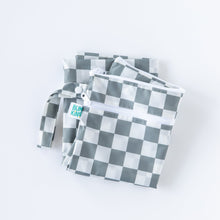 Load image into Gallery viewer, Bumkins Wet/Dry Bag: Charcoal Check lays folded on a white background.