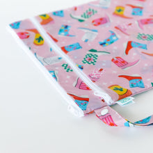 Load image into Gallery viewer, Close-up of Bumkins Wet/Dry Bag: Boots on a white background highlighting the waterproof fabric, two white zippers, and buttoned handle.