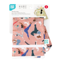 Load image into Gallery viewer, Bumkins Wet/Dry Bag: Yoga Pals is shown folded in its packaging.