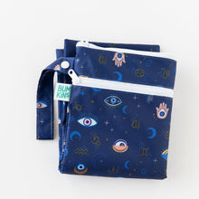 Load image into Gallery viewer, Bumkins Wet/Dry Bag: Evil Eye is folded on a white background.