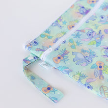 Load image into Gallery viewer, Close-up of Bumkins Wet/Dry Bag: Aloha Stitch on a white background, with focus on the zipper, strap, and Disney Baby logo tag.