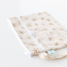 Load image into Gallery viewer, Bumkins Wet/Dry Clutch: Palm Daze rests on a white background, with focus on the zipper closure and side strap.
