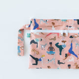 Close-up of Bumkins Wet/Dry Clutch: Yoga Pals on a white background.