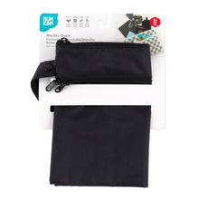 Load image into Gallery viewer, Bumkins Wet/Dry Clutch: Black is shown folded in its packaging.