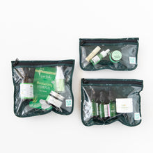 Load image into Gallery viewer, Bumkins Clear Travel Bag 3 Pack: Starry Cactus sits filled with skincare items on a white background.