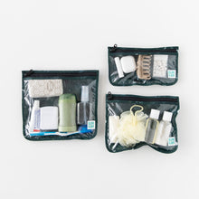 Load image into Gallery viewer, Bumkins Clear Travel Bag 3 Pack: Starry Cactus holds toiletries like toothpaste, deodorant, and spray bottles on a white background.