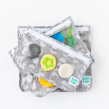 Load image into Gallery viewer, Bumkins Clear Travel Bag 3 Pack: Lunar Phase are stacked on a white background, filled with colorful play dough and cookie cutters.