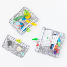 Load image into Gallery viewer, Bumkins Clear Travel Bag 3 Pack: Lunar Phase filled with colorful toys, markers, and modeling clay on a white background.