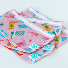 Load image into Gallery viewer, Close-up of Bumkins Clear Travel Bag 3 Pack: Boots stacked on a white background, showcasing the Bumkins logo label.