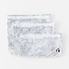 Load image into Gallery viewer, Roamio by Bumkins Clear Travel Bag 3 Pack: Disco Check lays stacked on a white background.
