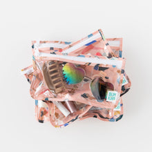 Load image into Gallery viewer, Bumkins Clear Travel Bag 3 Pack: Yoga Pals is stacked on a white background with sunglasses, a hair clip, and lipsticks inside.