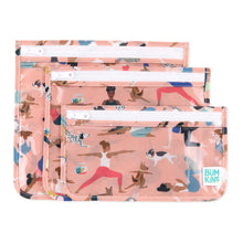 Load image into Gallery viewer, Bumkins Clear Travel Bag 3 Pack: Yoga Pals includes three TSA-compliant pouches with illustrations of people and animals in yoga poses.
