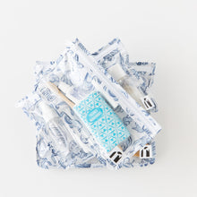 Load image into Gallery viewer, Roamio by Bumkins Clear Travel Bag 3 Pack: Shells lays stacked on a white background, filled with toiletries.
