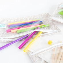 Load image into Gallery viewer, Close-up of Bumkins Clear Travel Bag 3-Pack: Wander on a white background, filled with colorful markers and art supplies.