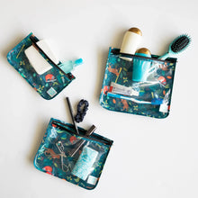Load image into Gallery viewer, Bumkins Clear Travel Bag 3-Pack: Jungle holds TSA-compliant toiletries, makeup, and accessories on a white background.