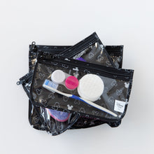 Load image into Gallery viewer, Bumkins Clear Travel Bag 3-Pack: Mickey Mouse Icon Black + White lays stacked on a white background, filled with toiletries.