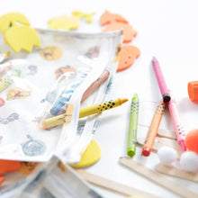 Load image into Gallery viewer, Close-up of colorful crayons and art supplies spilling from a Bumkins Clear Travel Bag 3-Pack: Winnie and Friends on a white background.
