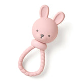 Itzy Ritzy Rattle, Pink Bunny Sweetie: bunny-shaped silicone teether with textured handle on white background.