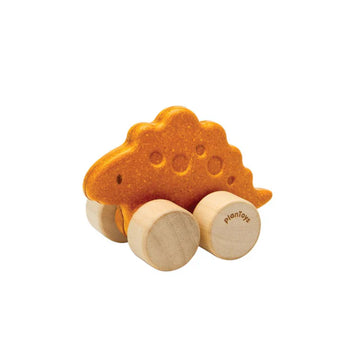Dino Car, Stego: orange ruberwood dinosaur toy with tan wheels with PlanToys logo.