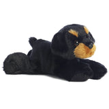 Aurora's Mini Flopsie Raina plush lies on its stomach with head up and ears down.