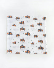 Load image into Gallery viewer, Little Unicorns Cotton Swaddle Set features white muslin with bison and green triangles, ideal for swaddling.
