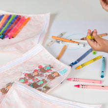 Load image into Gallery viewer, Close-up of a child at a white table, surrounded by crayons and Bumkins Clear Travel Bag 3-Pack: Lace with art supplies.