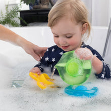 Load image into Gallery viewer, A toddler giggles, splashing in a bubble bath with Dimpl Splash by Fat Brain Toy Co, enhancing fine motor skills with a caregiver.