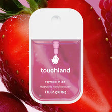 Load image into Gallery viewer, Hydrating Hand Sanitizer: pink sanitizer bottle with white cap & text "touchland Power Mist Hydrating hand sanitizer" on a strawberry half.