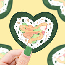 Load image into Gallery viewer, Turtle Soups Sushi Heart sticker: A cartoon hand holds a heart-shaped sushi piece on green, premium vinyl.