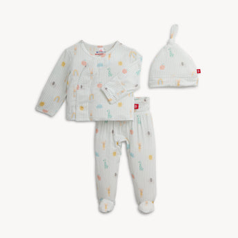 The Magnetic Me Kimono Lullaby Blue set features breathable modal, a wrap-style top, footed pants, and a matching knot hat.