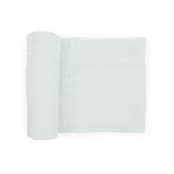 A Cotton Muslin Swaddle Blanket in Pale Pinstripe by Little Unicorn is partially unrolled on a white background.