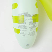 Load image into Gallery viewer, Close-up of safety warnings and batch info on Sunnylifes Monty the Monster, a lime-accented white inflatable pool noodle for kids.