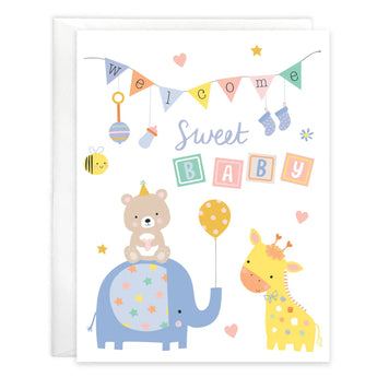 Gina B Designs Baby Card, Welcome Baby Friends features glittery WELCOME bunting, a bear on an elephant, a giraffe, and BABY blocks.