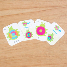 Load image into Gallery viewer, Bugzzle Game by Fat Brain Toy Co features four colorful, circular-patterned cards titled Buggzle and Solution for a brain challenge.
