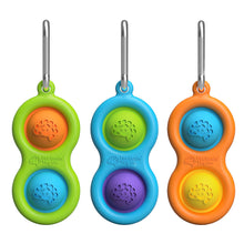 Load image into Gallery viewer, Three Simpl Dimpl poppers by Fat Brain Toy Co feature green, blue, and orange bubbles with metal clips for tactile stimulation.
