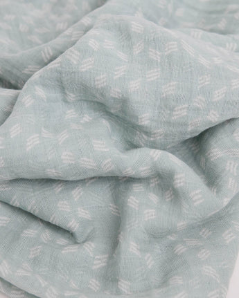 Little Unicorn’s Cotton Swaddle, Misty Field: light blue muslin with white geometric pattern, soft and breathable for babies.