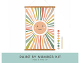 Kids Paint By Number Kit, Smiley Sunshine: sun hanging canvas, 2 brushes, & 8 acrylic paints. Text "Paint By Number Kit Ages 8 and Up."