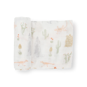 Little Unicorn Cotton Swaddle, Desert Night: white muslin with hand-painted desert animals and plants. Breathable and soft.