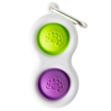Load image into Gallery viewer, The Simpl Dimpl by Fat Brain Toy Co is a white fidget keychain with green and purple silicone buttons for tactile fun, with a metal clip.
