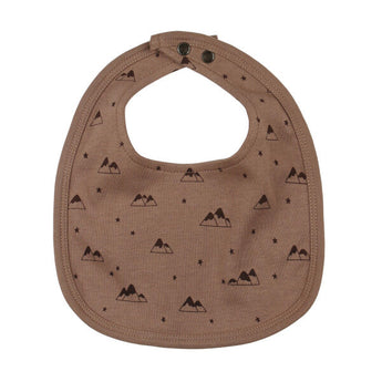 Organic Reversible Bib: brown bib with mountain pattern and snap closure.