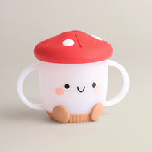 Load image into Gallery viewer, Itzy Ritzys Itzy Snack Cup is a mushroom-shaped sippy with a silicone lid, red top, smiley face, dual handles; dishwasher-safe!.
