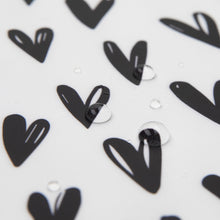 Load image into Gallery viewer, Close-up of water droplets on Bumkins Splat Mat: Hearts.
