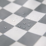 Close-up of water droplets on Bumkins Wet/Dry Bag: Charcoal Check.