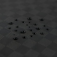 Load image into Gallery viewer, Close-up of water droplets on Roamio by Bumkins Wet Bag: Rich Black.
